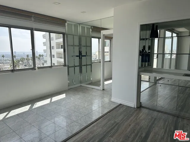 a view of a room that has a large window