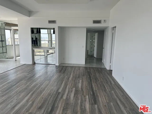 wooden floor in a hall with an entryway and a wooden floor