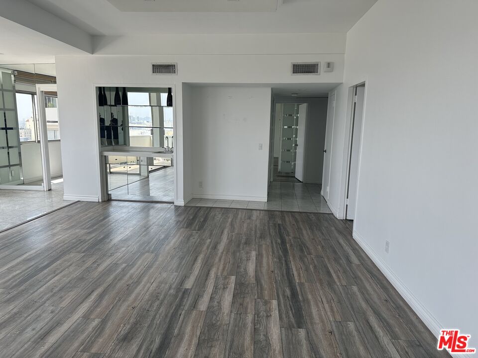 7250 Franklin Avenue, Unit 702 Los Angeles, CA 90046 - Photo 20 of 39 wooden floor in a hall with an entryway and a wooden floor