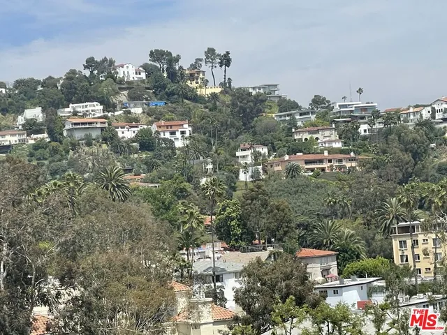 a view of city with tall buildings