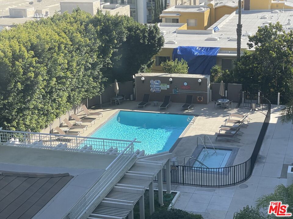 7250 Franklin Avenue, Unit 702 Los Angeles, CA 90046 - Photo 29 of 39 a view of a swimming pool with a patio