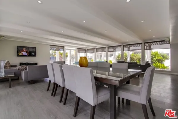 a view of a dining room with furniture window and wooden floor