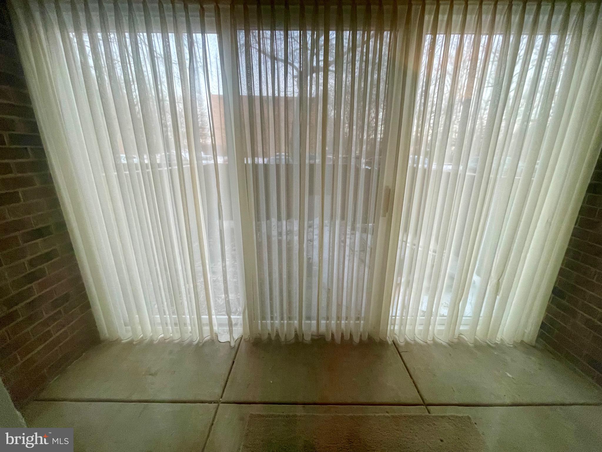 8493 Greenbelt Road, Unit T2 Greenbelt, MD 20770 - Photo 11 of 11 Enclosed patio with access to the rear yard