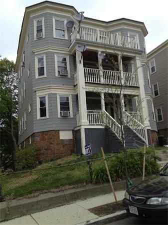 98 Montebello Road Boston, MA 02130 - Photo 4 of 4 a front view of a house with a yard