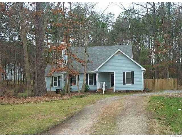 301 Paprika Court Raleigh, NC 27614 - Photo 1 of 1 a view of a yard in front of a house with large windows