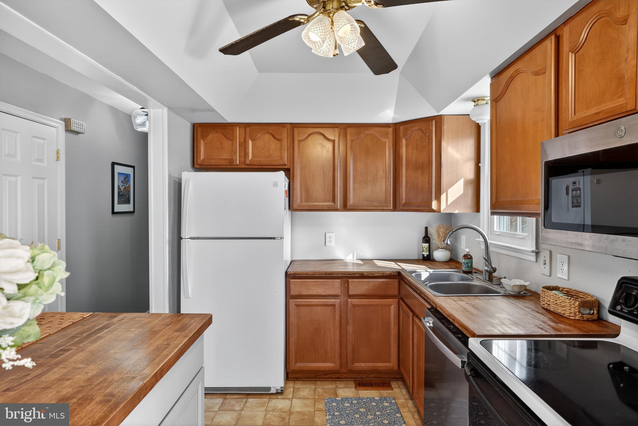 621 Holly Corner Road Fredericksburg, VA 22406 - Photo 12 of 48 Bright and inviting kitchen with wooden accents.