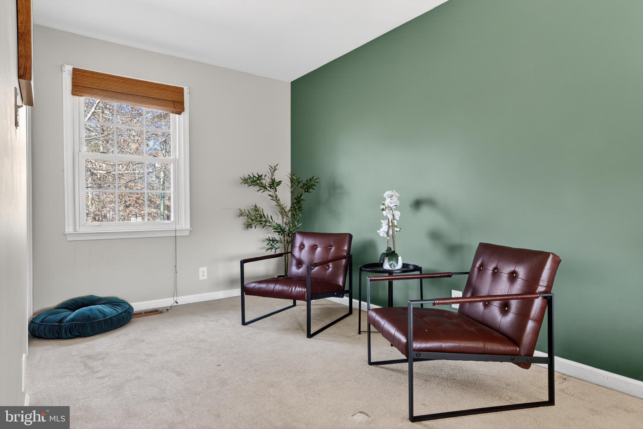 621 Holly Corner Road Fredericksburg, VA 22406 - Photo 18 of 48 Inviting corner with modern seating and greenery.