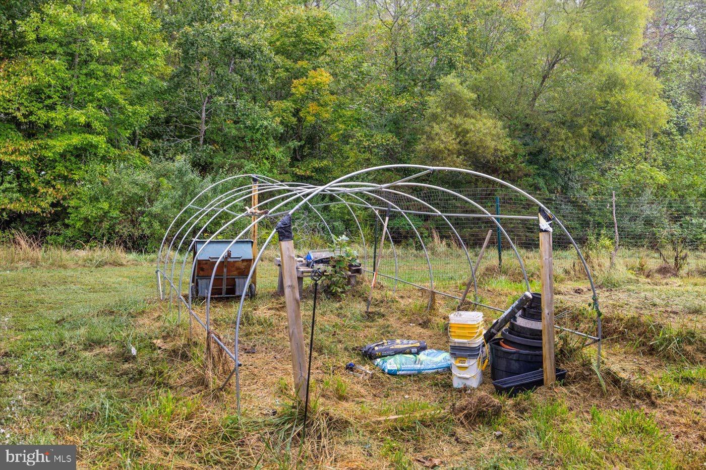 621 Holly Corner Road Fredericksburg, VA 22406 - Photo 27 of 48 Garden structure amidst lush greenery.