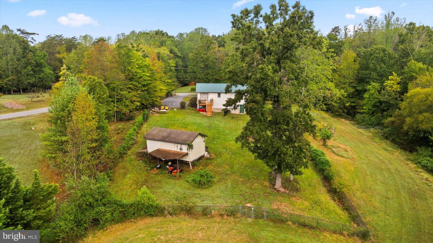 621 Holly Corner Road Fredericksburg, VA 22406 - Photo 32 of 48 Serene countryside retreat with lush greenery.