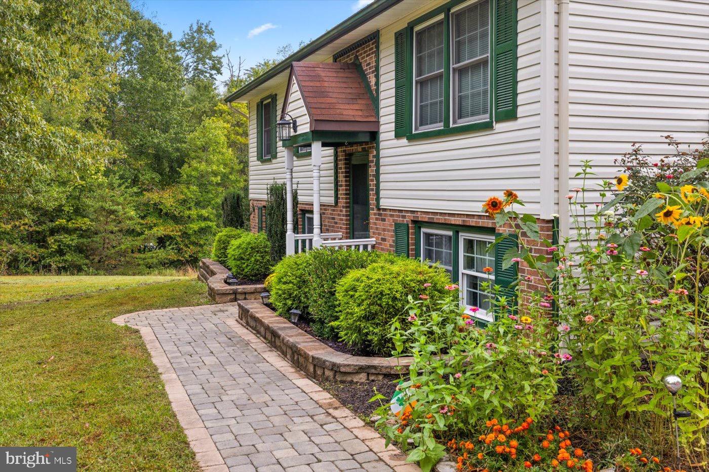 621 Holly Corner Road Fredericksburg, VA 22406 - Photo 5 of 48 Charming home with vibrant garden path.