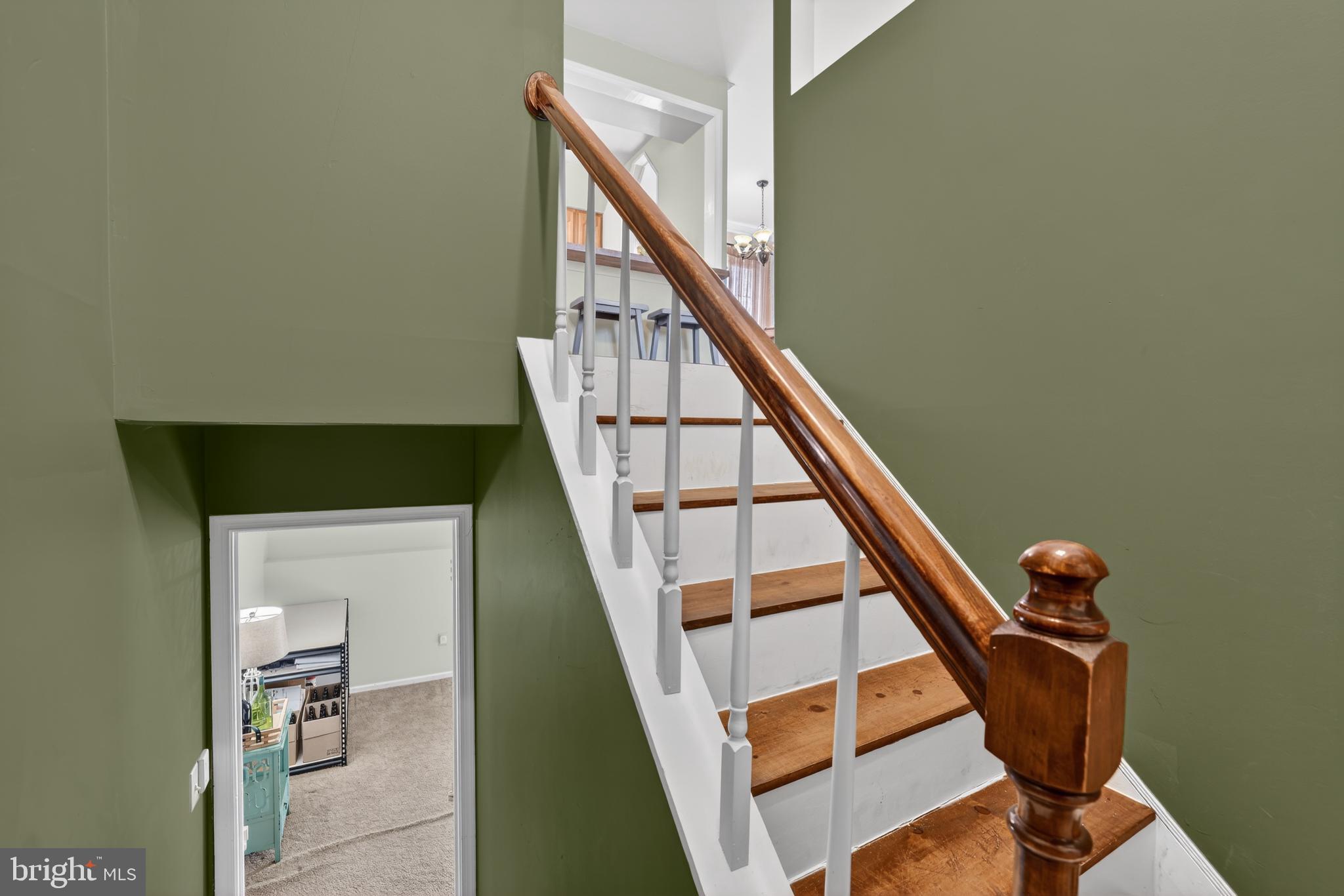 621 Holly Corner Road Fredericksburg, VA 22406 - Photo 6 of 48 Inviting staircase with rich green walls.