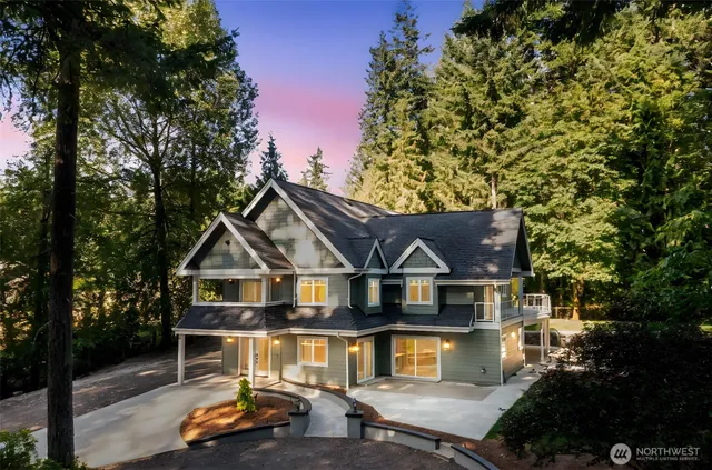 a view of house with outdoor space and sitting area