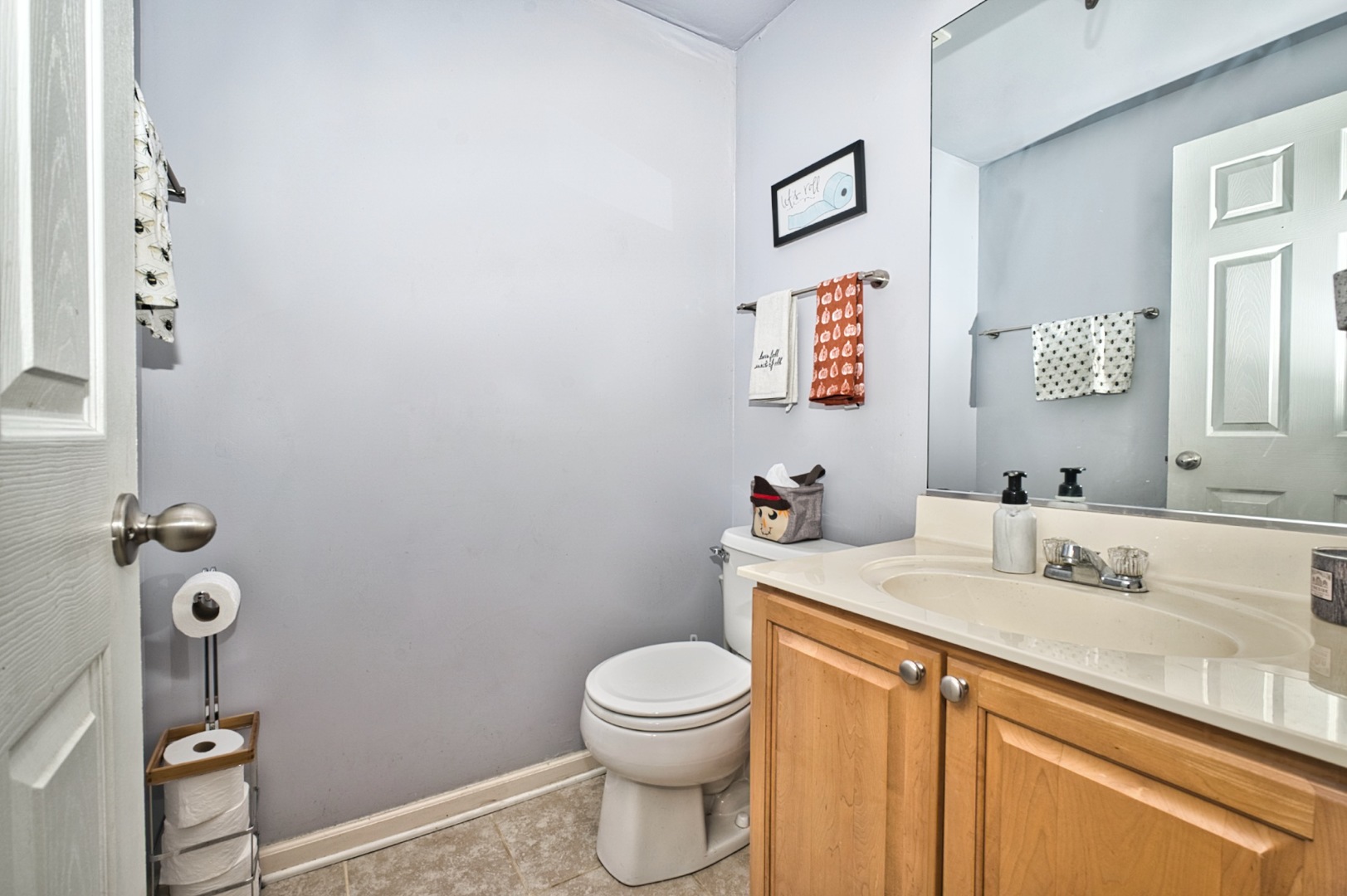 3465 Ravinia Circle Aurora, IL 60504 - Photo 22 of 40 a bathroom with a sink a toilet and mirror