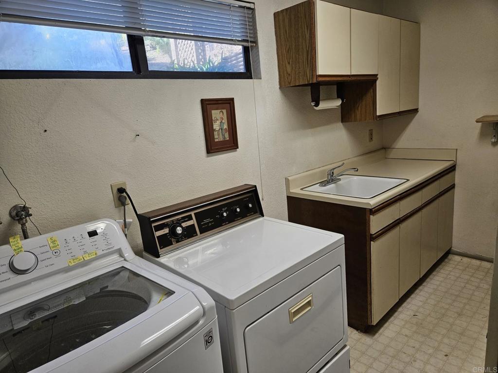 28124 Mountain Meadow Road Escondido, CA 92026 - Photo 21 of 31 a utility room with dryer and washer