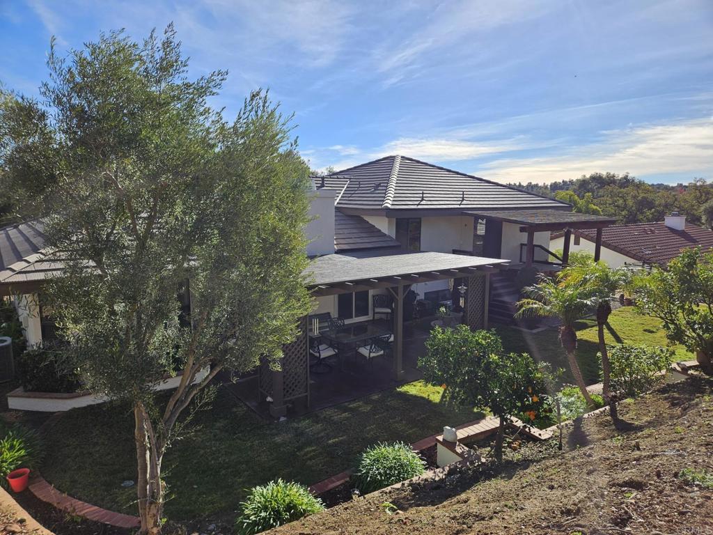 28124 Mountain Meadow Road Escondido, CA 92026 - Photo 4 of 31 a front view of a house with a yard