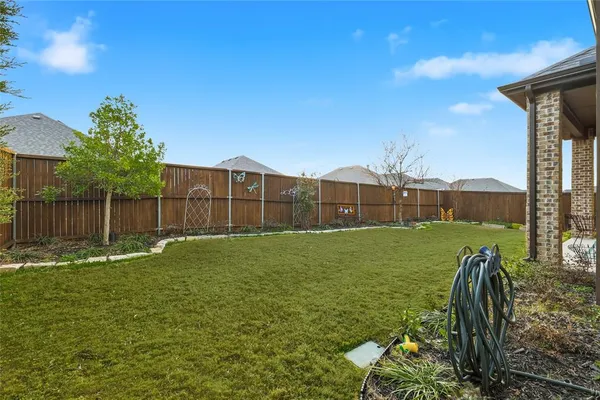a outdoor living space with furniture and a potted plant