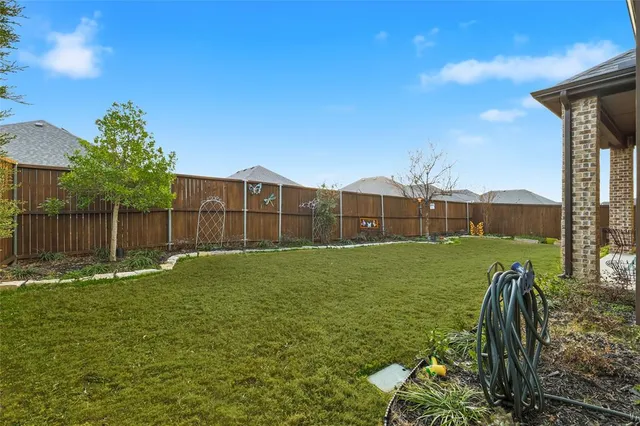 a outdoor living space with furniture and a potted plant