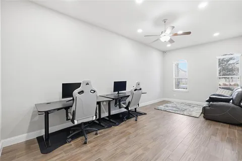 a view of a dining room with furniture and a table