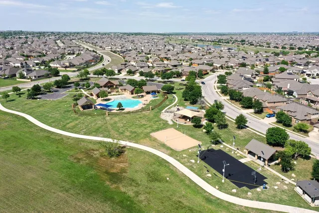 an aerial view of residential houses with outdoor space