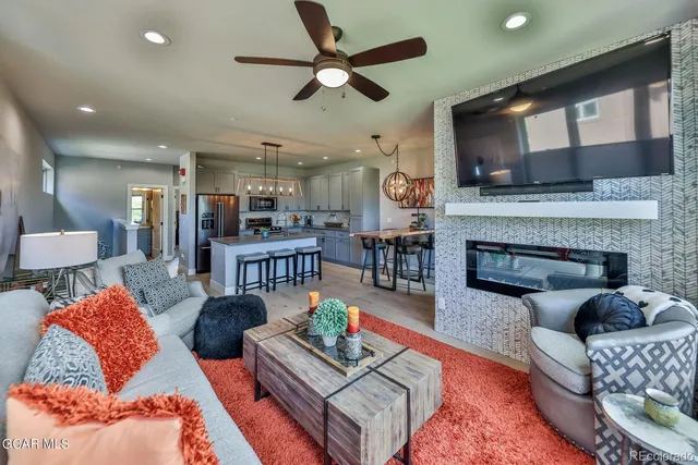 a living room with furniture and a fireplace