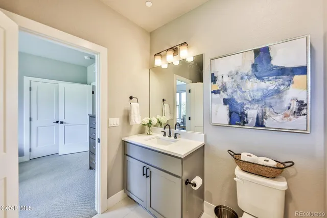 a bathroom with a double vanity sink mirror and double