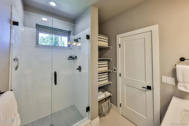 a bathroom with a shower and toilet