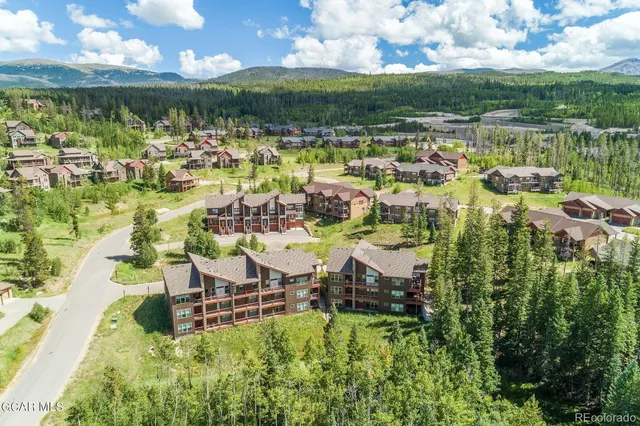 a view of a lake with a house swimming pool and outdoor space