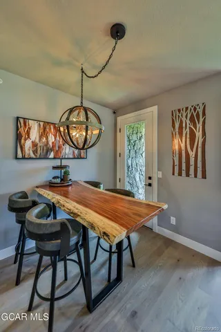 a dining room with furniture and window