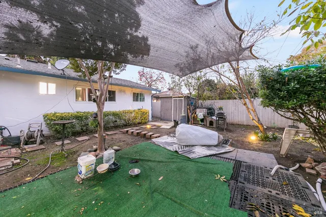 a room with gym equipment and a view of living room