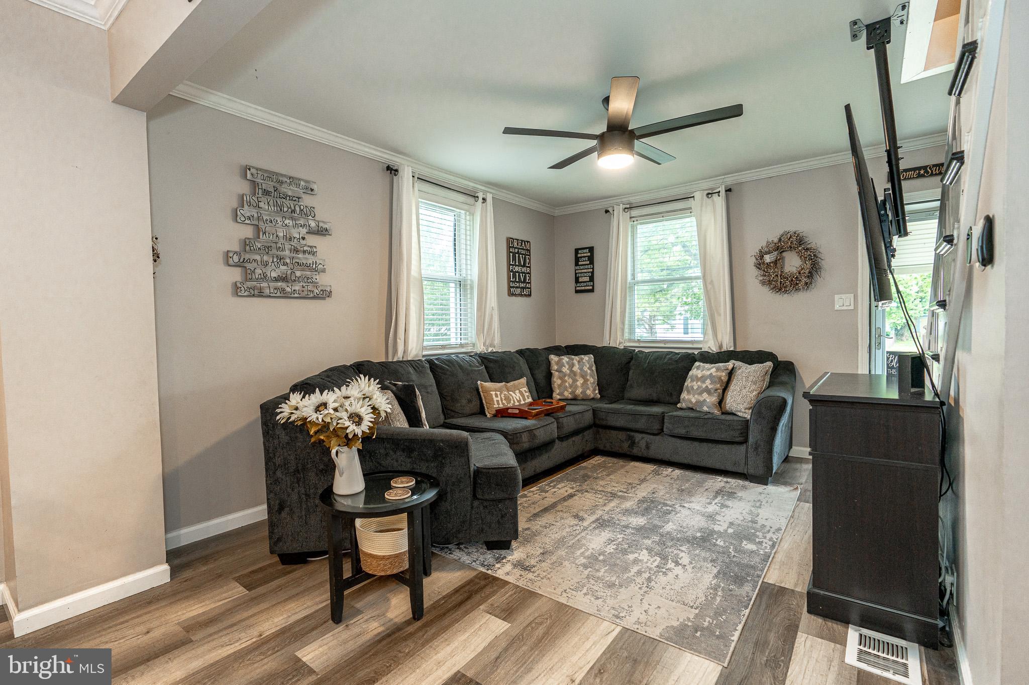 220 Pinewood Road Baltimore, MD 21222 - Photo 11 of 45 a living room with furniture and a large window