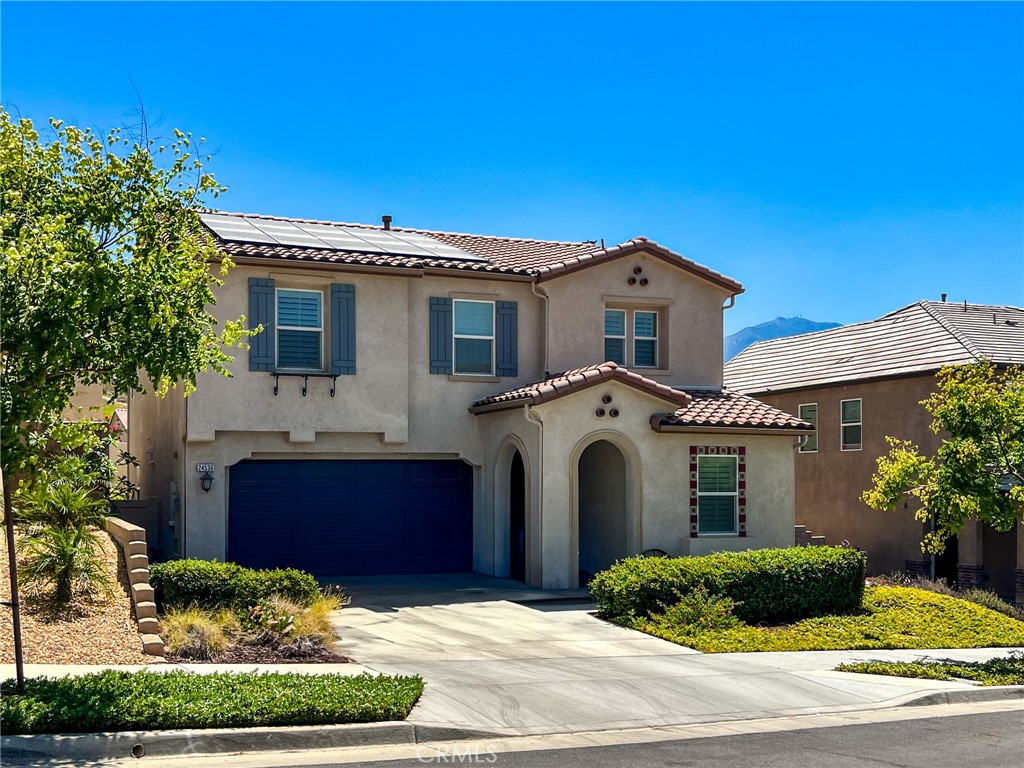 24536 Acadia Drive Corona, CA 92883 - Photo 1 of 40 a front view of a house with a yard and garage