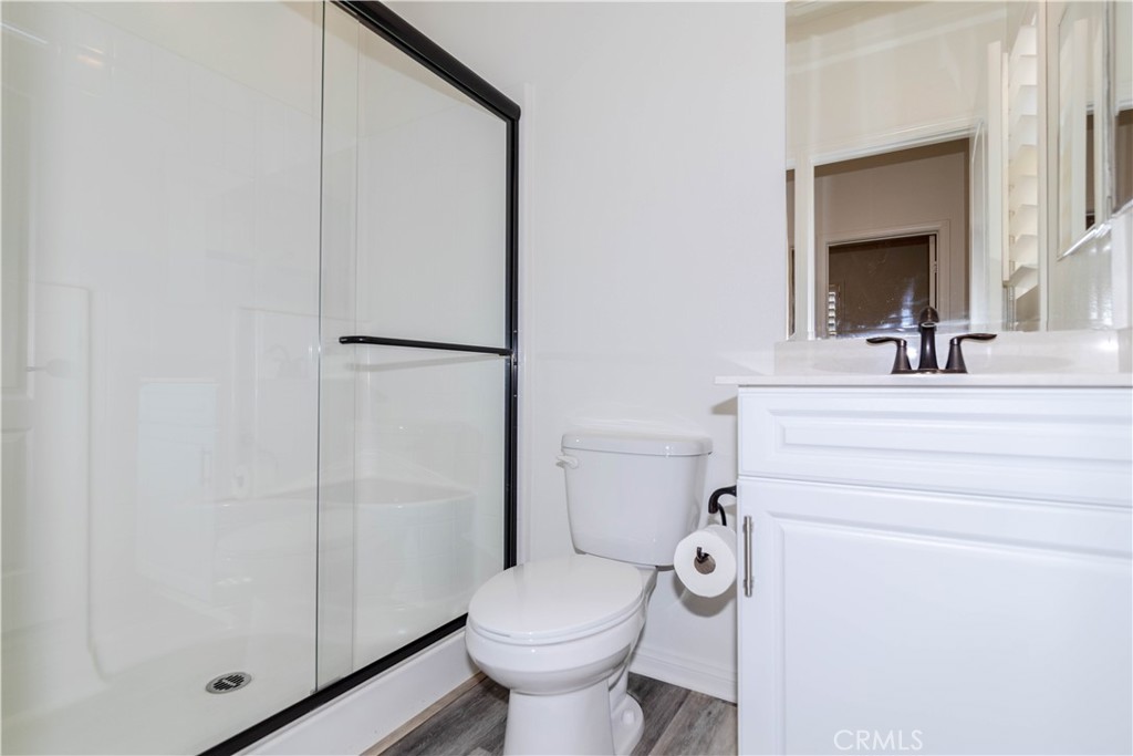 24536 Acadia Drive Corona, CA 92883 - Photo 12 of 40 a bathroom with a sink toilet and shower