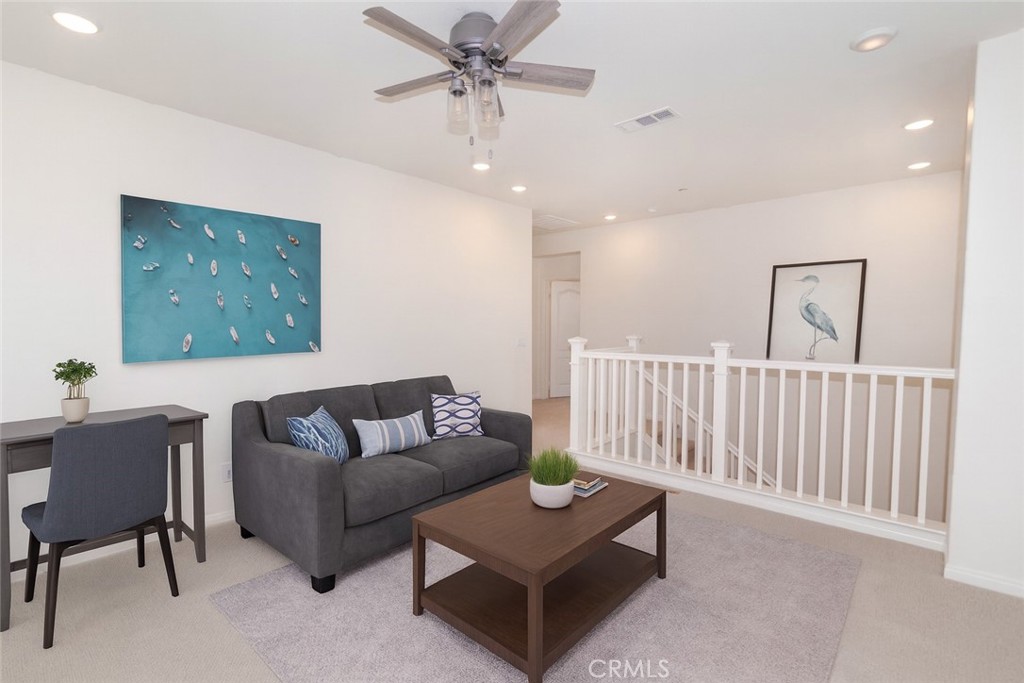 24536 Acadia Drive Corona, CA 92883 - Photo 15 of 40 a living room with furniture and a ceiling fan