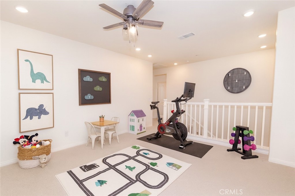 24536 Acadia Drive Corona, CA 92883 - Photo 16 of 40 a view of a room with gym equipment