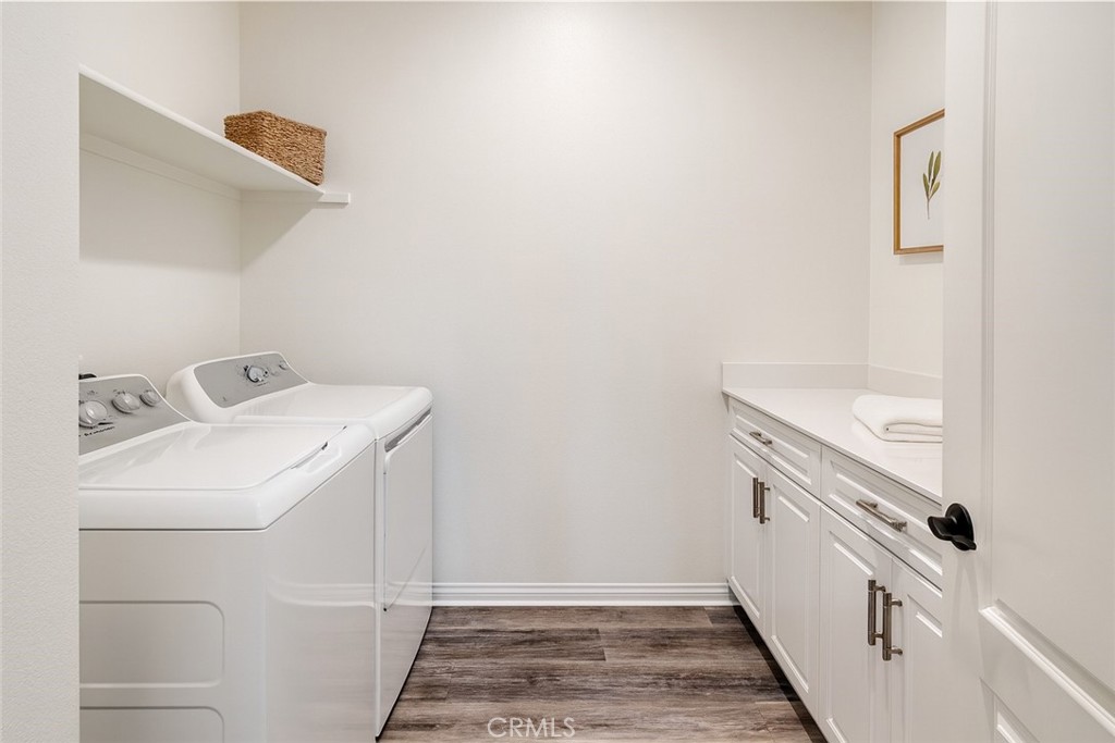 24536 Acadia Drive Corona, CA 92883 - Photo 18 of 40 a bathroom with a sink and a washer dryer