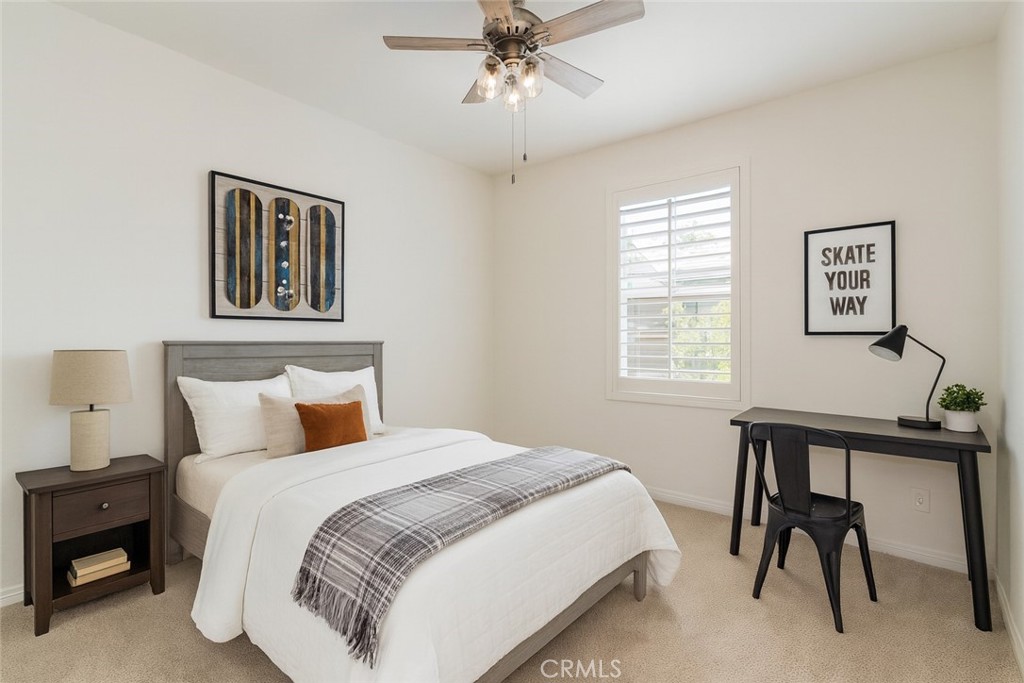 24536 Acadia Drive Corona, CA 92883 - Photo 26 of 40 a bedroom with a bed and a desk