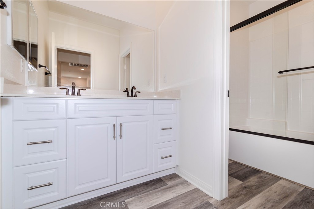 24536 Acadia Drive Corona, CA 92883 - Photo 27 of 40 a bathroom with a sink and a mirror