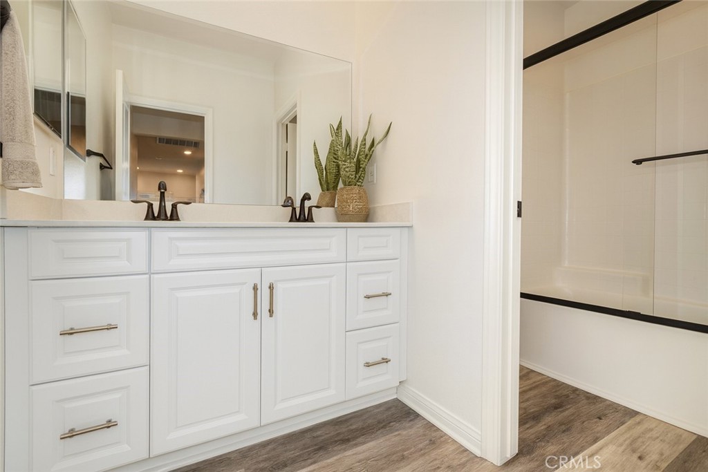 24536 Acadia Drive Corona, CA 92883 - Photo 28 of 40 a bathroom with a sink and a mirror