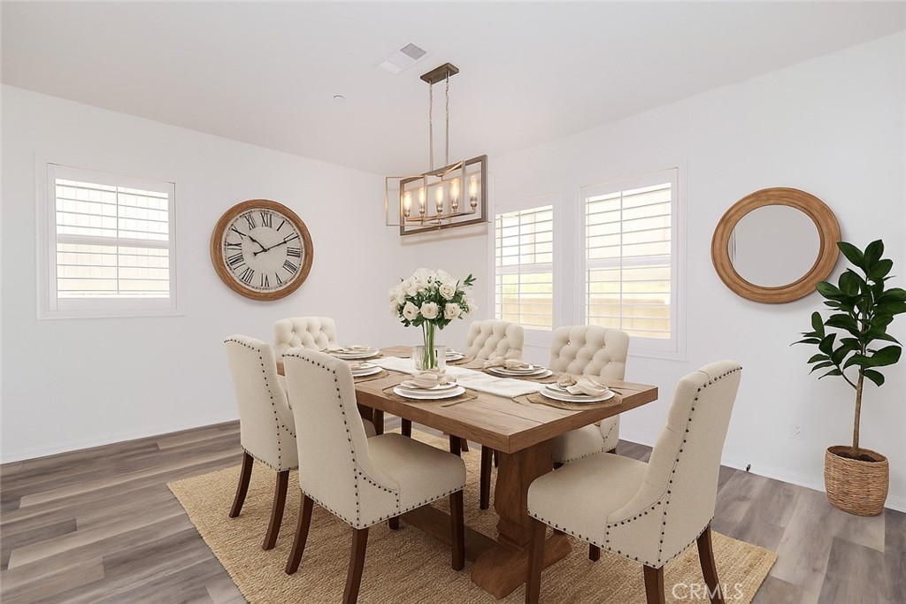 24536 Acadia Drive Corona, CA 92883 - Photo 9 of 40 a view of a dining room with furniture window and wooden floor