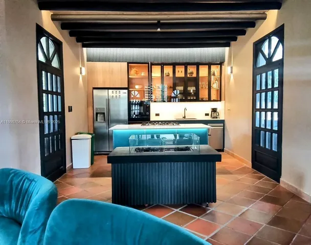 a view of kitchen and dining area with furniture