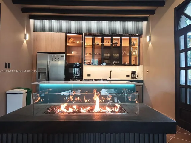 a view of a livingroom with furniture and a potted plant