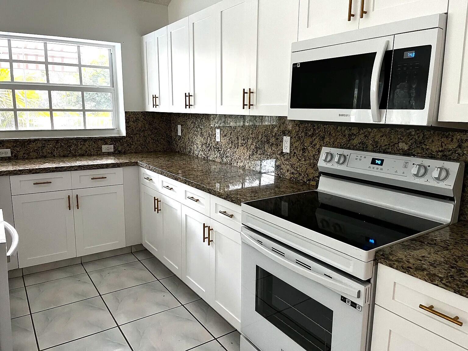 9590 Islamorada Terrace Boca Raton, FL 33496 - Photo 5 of 8 Updated Kitchen-White Cabinets