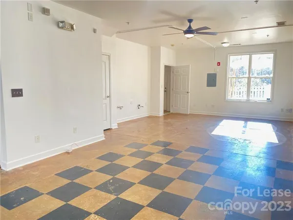 a view of a livingroom with a black and white checkered floor