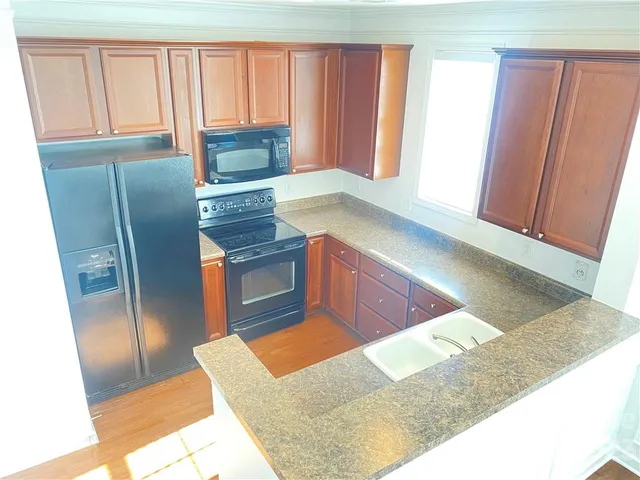 a view of kitchen with wooden floor
