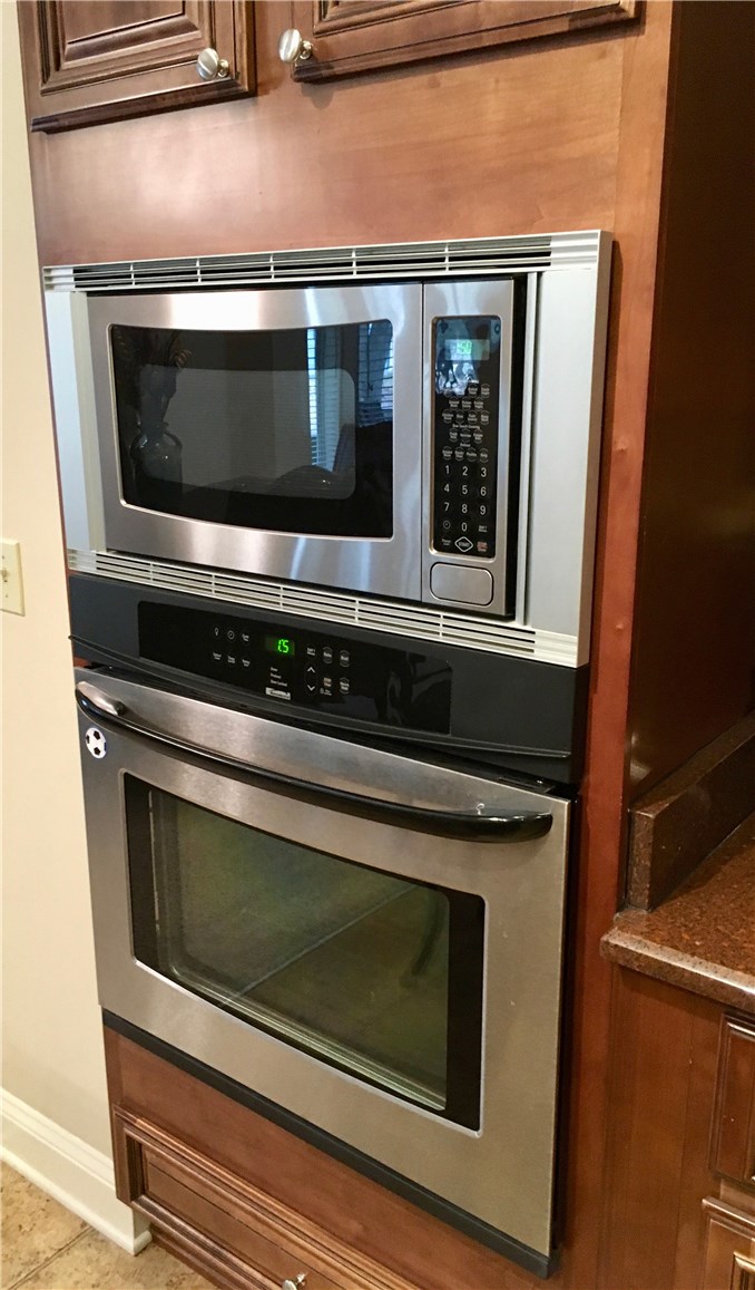 96525 Chester Road Yulee, FL 32097 - Photo 11 of 35 a stove top oven sitting inside of a kitchen