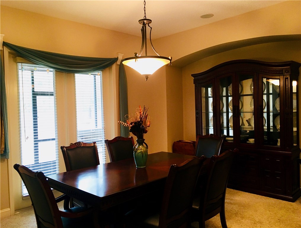 96525 Chester Road Yulee, FL 32097 - Photo 12 of 35 a dining room with furniture and window