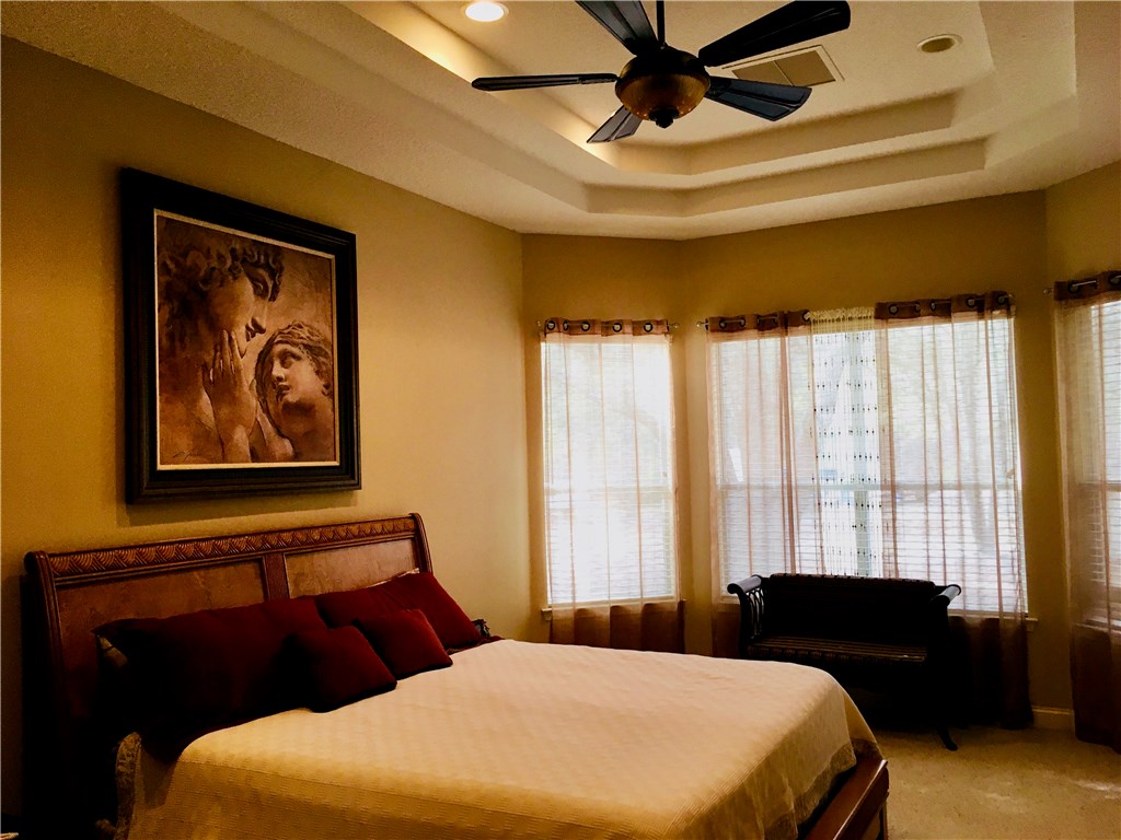 96525 Chester Road Yulee, FL 32097 - Photo 14 of 35 a bedroom with a bed and wooden floor