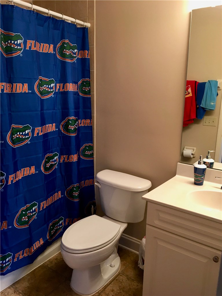 96525 Chester Road Yulee, FL 32097 - Photo 20 of 35 a bathroom with a toilet and a sink