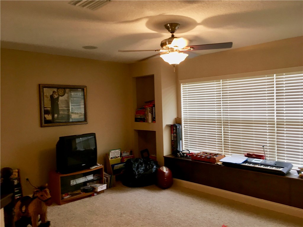 96525 Chester Road Yulee, FL 32097 - Photo 24 of 35 a bedroom with furniture and a window