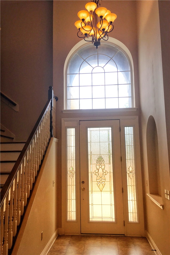 96525 Chester Road Yulee, FL 32097 - Photo 3 of 35 a view of hall way with wooden floor and staircase
